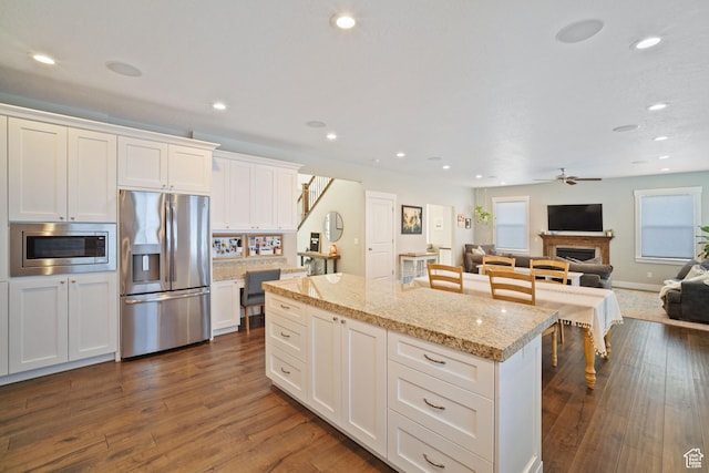 2558 Mountain Glen Rd, Erda, UT 84074 - kitchen featuring stainless steel appliances, ceiling fan, plenty of natural light, a kitchen island, and recessed lighting