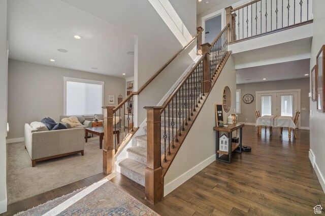 2558 Mountain Glen Rd, Erda, UT 84074 - stairs featuring wood finished floors, baseboards, recessed lighting, and french doors