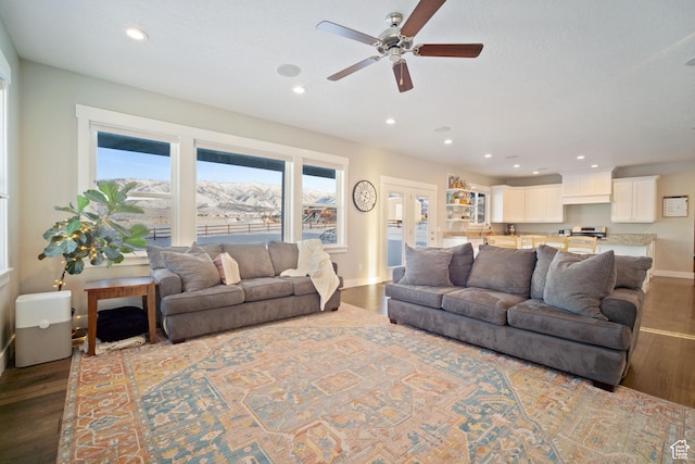 2558 Mountain Glen Rd, Erda, UT 84074 - living area with wood finished floors, a ceiling fan, baseboards, and recessed lighting