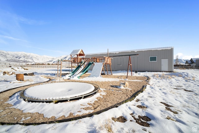 2558 Mountain Glen Rd, Erda, UT 84074 - snow covered playground featuring a playground and a pole building