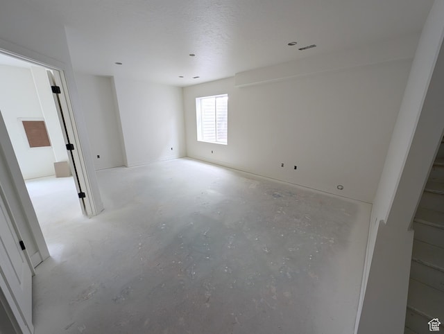 7077 W Granbury Dr S Unit 257, South Jordan, UT 84009 - spare room with concrete flooring