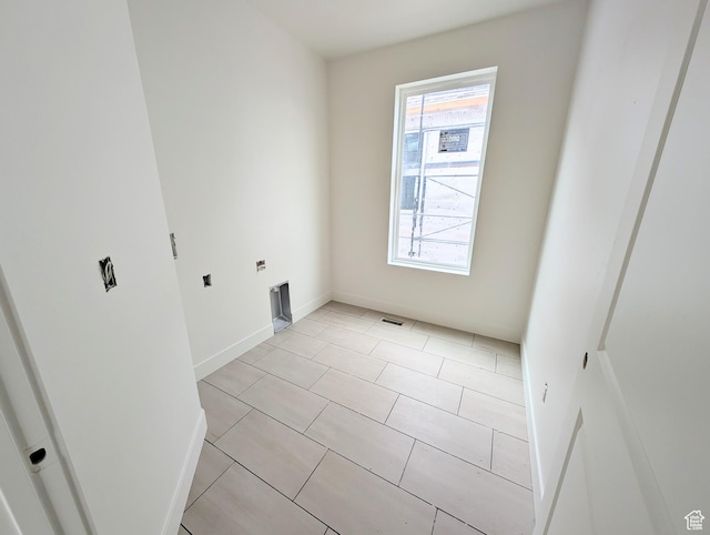 7077 W Granbury Dr S Unit 257, South Jordan, UT 84009 - empty room featuring baseboards and light tile patterned floors