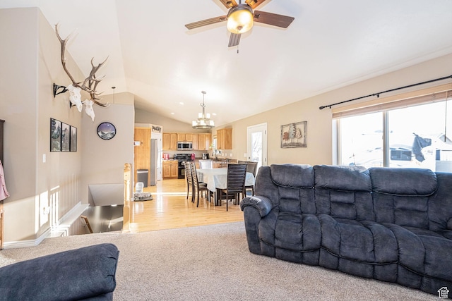 624 N 800 E, Wellsville, UT 84339 - living area with a chandelier, vaulted ceiling, light colored carpet, ceiling fan, and light wood-style flooring