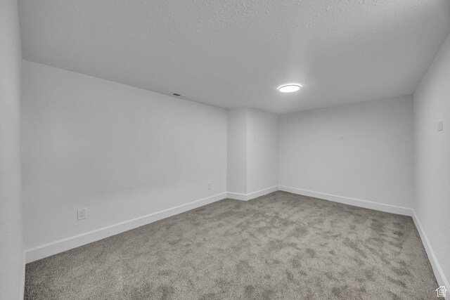 590 E 7th St, Ogden, UT 84404 - empty room with visible vents, baseboards, carpet, and a textured ceiling