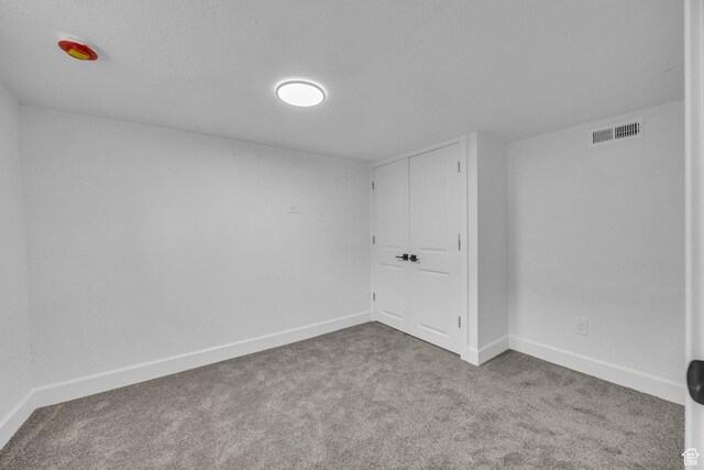 590 E 7th St, Ogden, UT 84404 - empty room with visible vents, baseboards, and carpet flooring
