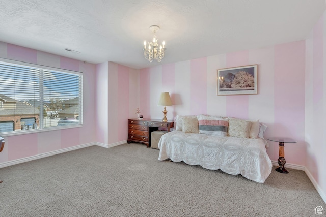 carpeted bedroom with a notable chandelier, baseboards, a textured ceiling, and visible vents