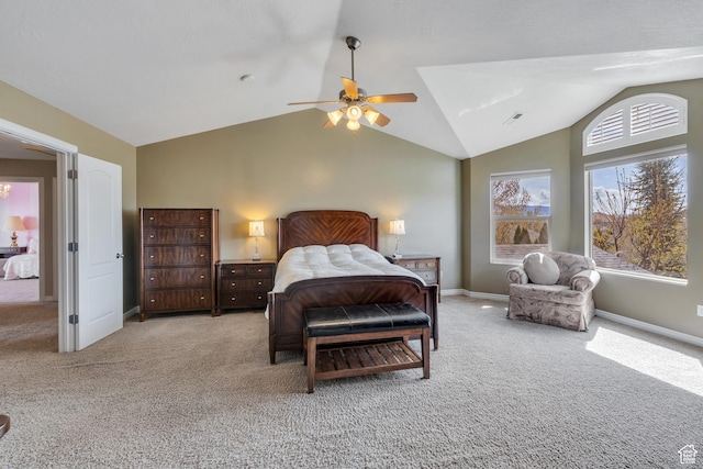 bedroom with baseboards, lofted ceiling, and carpet