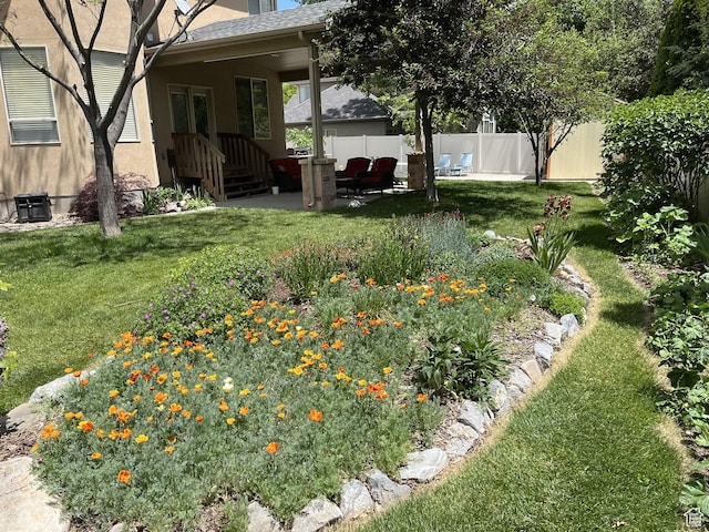 view of yard featuring a patio area and fence