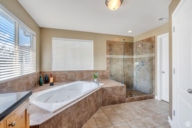 full bath with visible vents, tile patterned floors, a shower stall, and a jetted tub