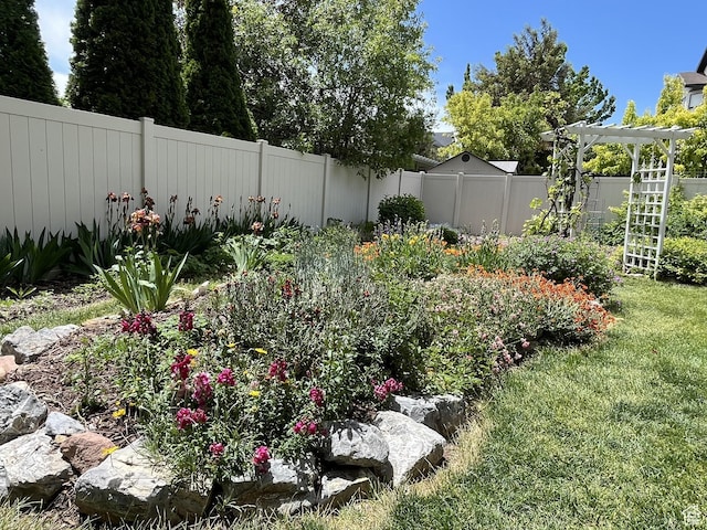 view of yard with a pergola and a fenced backyard
