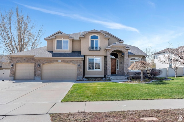 view of front of property with driveway, a front yard, fence, and stucco siding