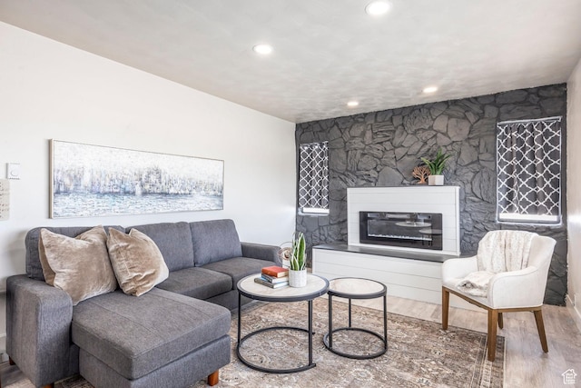 3061 W 13800 S, Bluffdale, UT 84065 - living area with a glass covered fireplace, recessed lighting, and wood finished floors