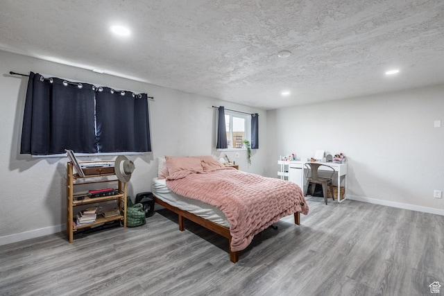 3061 W 13800 S, Bluffdale, UT 84065 - bedroom featuring recessed lighting, a textured ceiling, baseboards, and wood finished floors