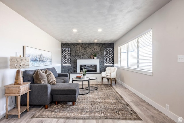 3061 W 13800 S, Bluffdale, UT 84065 - living area featuring recessed lighting, a large fireplace, baseboards, and wood finished floors