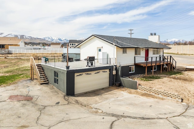 3061 W 13800 S, Bluffdale, UT 84065 - view of front of home featuring stairway, fence, driveway, a chimney, and a garage