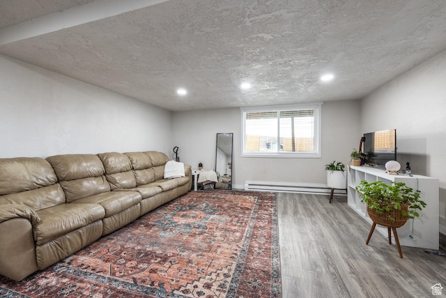 3061 W 13800 S, Bluffdale, UT 84065 - living room featuring a baseboard radiator, a textured ceiling, baseboards, and wood finished floors