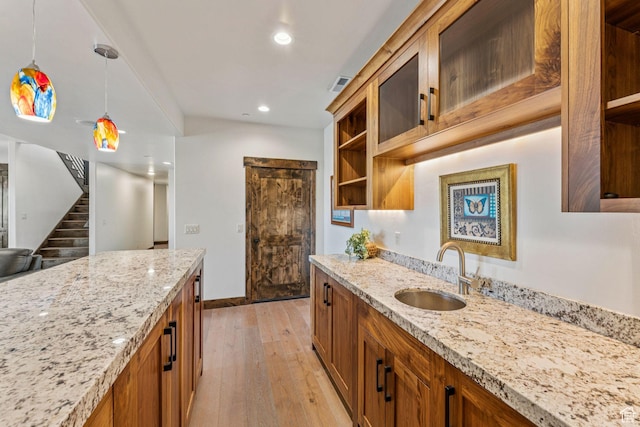 1075 N Oquirrh Mountain Dr Unit 64, Heber City, UT 84032 - kitchen featuring open shelves, brown cabinetry, light wood finished floors, pendant lighting, and recessed lighting