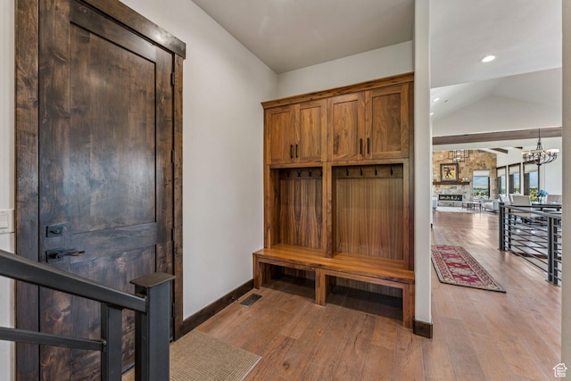 1075 N Oquirrh Mountain Dr Unit 64, Heber City, UT 84032 - mudroom featuring light wood-style floors, lofted ceiling, and a chandelier