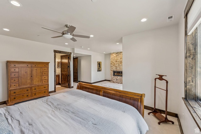 1075 N Oquirrh Mountain Dr Unit 64, Heber City, UT 84032 - bedroom with recessed lighting, light colored carpet, a stone fireplace, ceiling fan, and ensuite bath