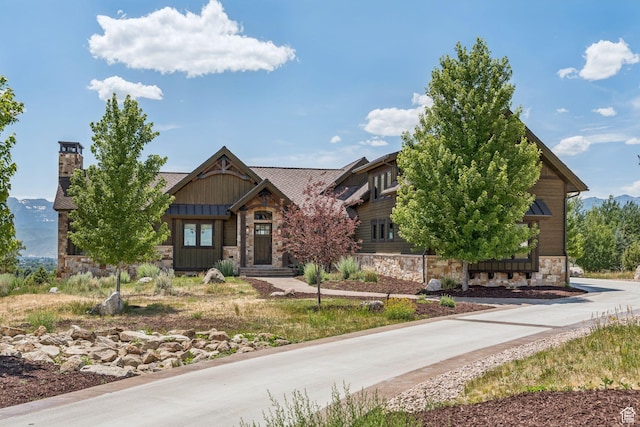 1075 N Oquirrh Mountain Dr Unit 64, Heber City, UT 84032 - view of front of property with stone siding and a chimney