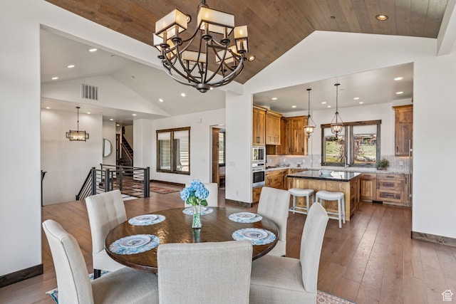 1075 N Oquirrh Mountain Dr Unit 64, Heber City, UT 84032 - dining room featuring a chandelier, recessed lighting, stairs, hardwood / wood-style floors, and high vaulted ceiling