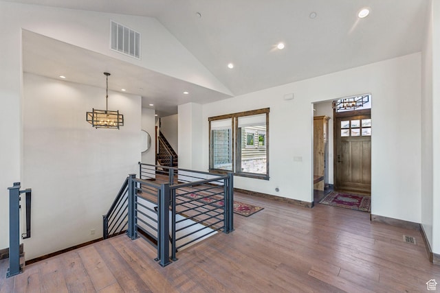 1075 N Oquirrh Mountain Dr Unit 64, Heber City, UT 84032 - entryway featuring healthy amount of natural light, vaulted ceiling, wood-type flooring, a chandelier, and recessed lighting