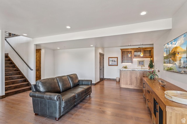 1075 N Oquirrh Mountain Dr Unit 64, Heber City, UT 84032 - living area featuring dark wood-style floors, stairs, recessed lighting, and bar area