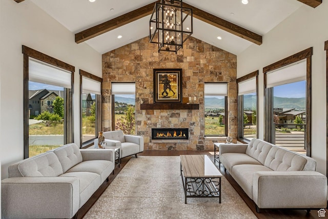 1075 N Oquirrh Mountain Dr Unit 64, Heber City, UT 84032 - living area with a large fireplace, beam ceiling, wood finished floors, recessed lighting, and a chandelier