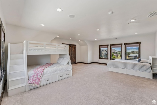 1075 N Oquirrh Mountain Dr Unit 64, Heber City, UT 84032 - bedroom with light colored carpet, recessed lighting, and a barn door
