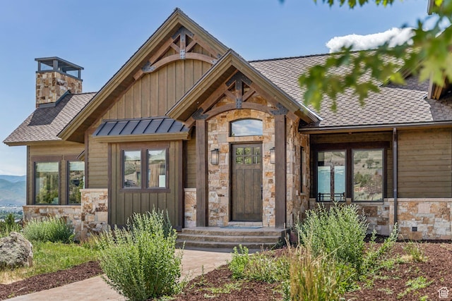 1075 N Oquirrh Mountain Dr Unit 64, Heber City, UT 84032 - doorway to property featuring stone siding, board and batten siding, and a shingled roof