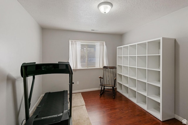 8246 N Cedar Springs Rd Unit 1, Eagle Mountain, UT 84005 - workout room with visible vents, baseboards, a textured ceiling, and wood finished floors