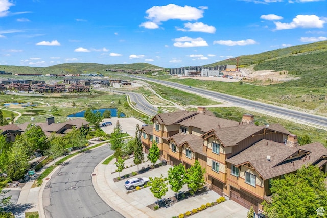 drone / aerial view featuring a mountain view and a residential view