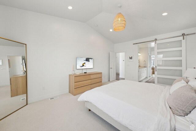 541 N 1400 E, Heber City, UT 84032 - bedroom with visible vents, ensuite bathroom, a barn door, light colored carpet, and vaulted ceiling
