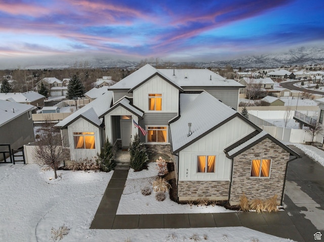 541 N 1400 E, Heber City, UT 84032 - modern inspired farmhouse featuring stone siding, board and batten siding, a residential view, and fence