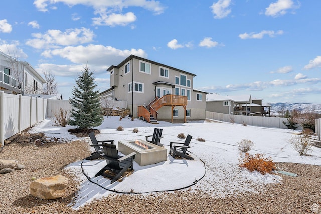 541 N 1400 E, Heber City, UT 84032 - snow covered rear of property featuring stairway, a fire pit, a fenced backyard, and stucco siding