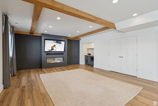 541 N 1400 E, Heber City, UT 84032 - unfurnished living room with beamed ceiling, recessed lighting, light wood-style floors, and a large fireplace