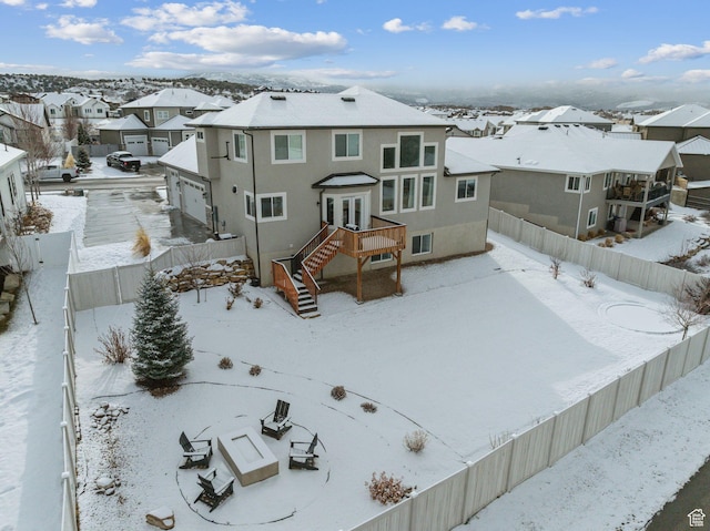 541 N 1400 E, Heber City, UT 84032 - snow covered property featuring a residential view, stucco siding, and a fenced backyard