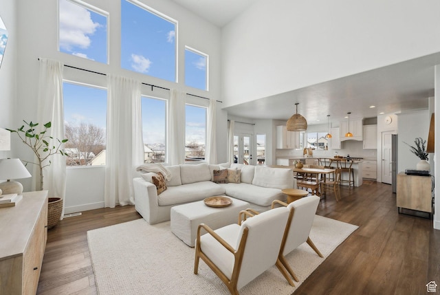 541 N 1400 E, Heber City, UT 84032 - living area with dark wood-type flooring, baseboards, and a towering ceiling