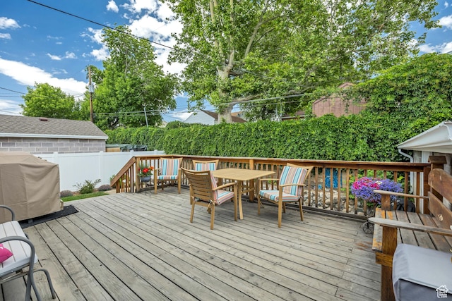 357 S 600 E, Clearfield, UT 84015 - wooden terrace with area for grilling, a fenced backyard, and outdoor dining space