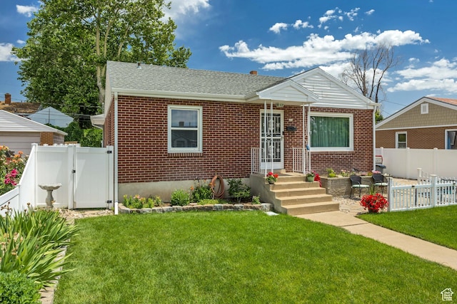 357 S 600 E, Clearfield, UT 84015 - bungalow-style house featuring brick siding, a gate, roof with shingles, and a patio