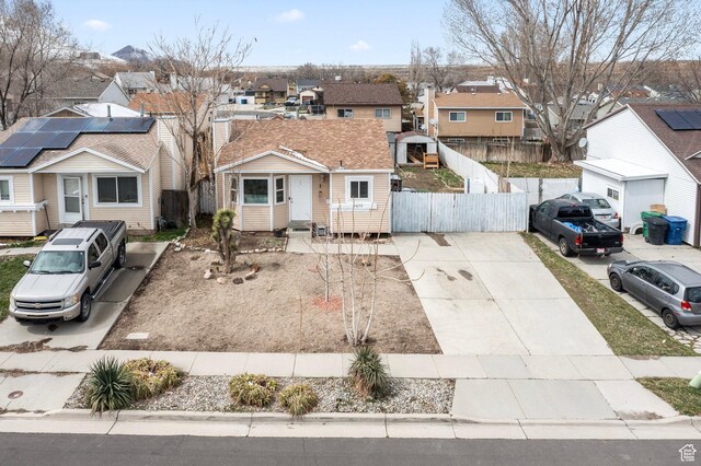 2670 S Melville Dr, Magna, UT 84044 - view of front facade featuring a residential view and fence
