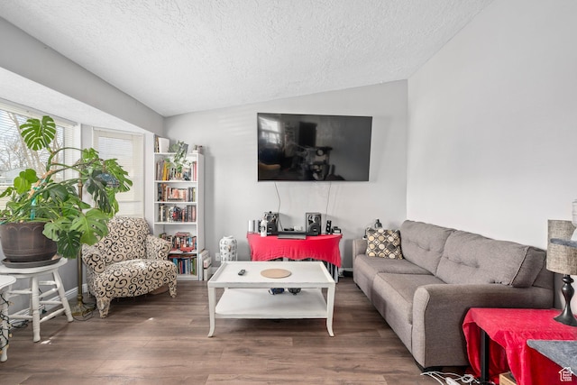 2670 S Melville Dr, Magna, UT 84044 - living room featuring a textured ceiling, lofted ceiling, and wood finished floors