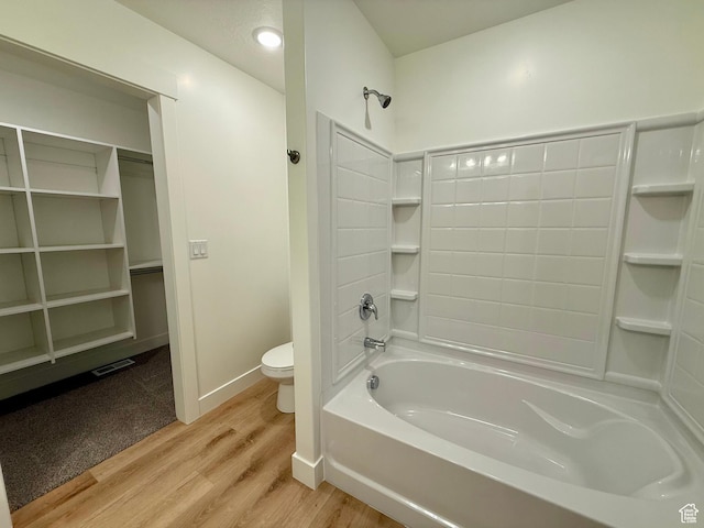3362 S 1010 W, Nibley, UT 84321 - bathroom featuring visible vents, toilet, wood finished floors,  shower combination, and baseboards
