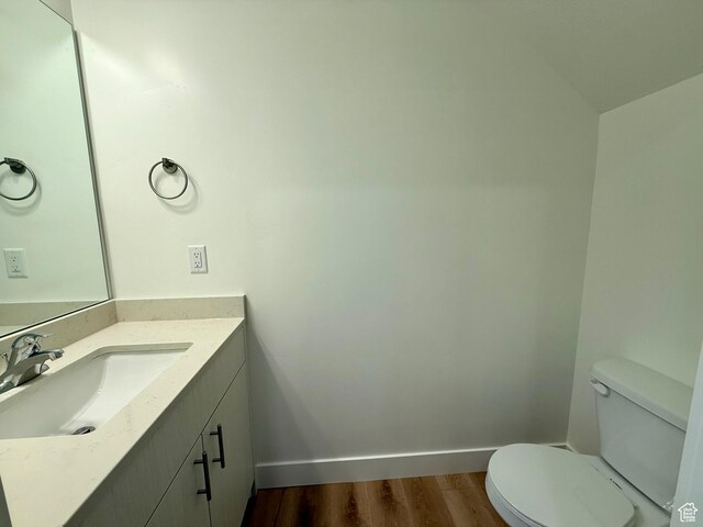 3362 S 1010 W, Nibley, UT 84321 - half bath with vanity, toilet, wood finished floors, and baseboards