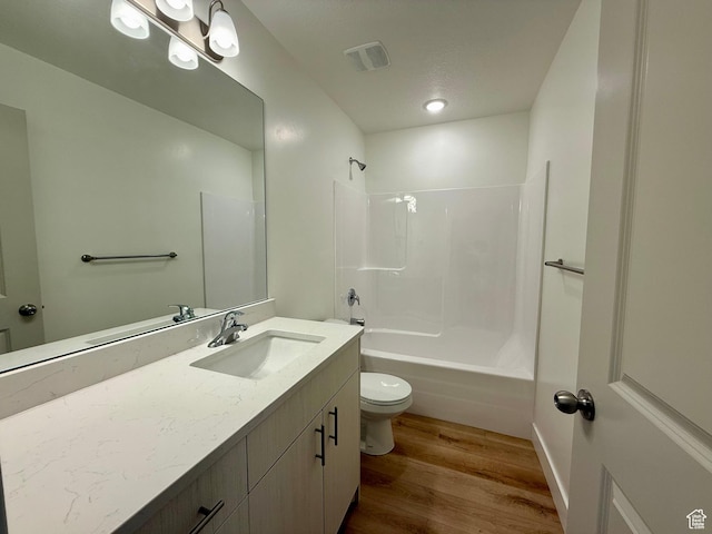 3362 S 1010 W, Nibley, UT 84321 - full bathroom featuring visible vents, toilet, bathing tub / shower combination, wood finished floors, and vanity
