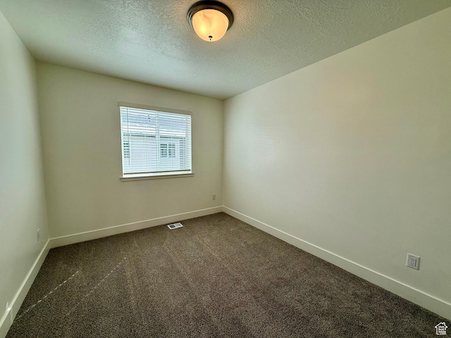 3362 S 1010 W, Nibley, UT 84321 - unfurnished room featuring visible vents, dark carpet, a textured ceiling, and baseboards