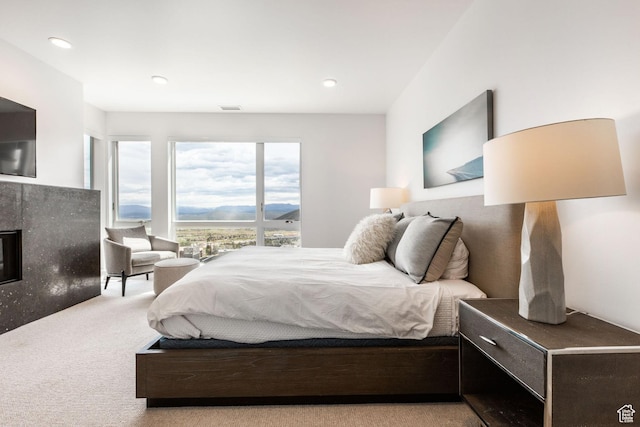 2752 W High Mountain Rd Unit 306, Park City, UT 84098 - bedroom with visible vents, recessed lighting, a mountain view, carpet floors, and a fireplace