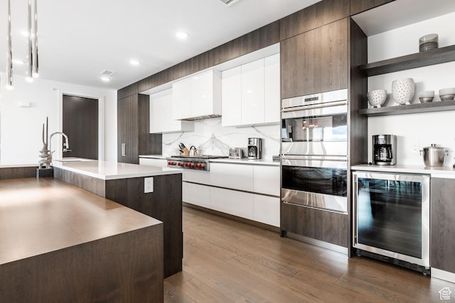 2752 W High Mountain Rd Unit 306, Park City, UT 84098 - kitchen featuring modern cabinets, beverage cooler, open shelves, dark wood finished floors, and stainless steel appliances