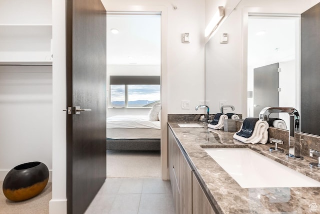 2752 W High Mountain Rd Unit 306, Park City, UT 84098 - bathroom featuring tile patterned floors, double vanity, ensuite bath, and a sink