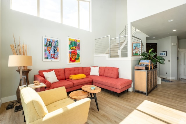 8077 Courtyard Loop Unit 11, Park City, UT 84098 - living area featuring light wood-type flooring, stairs, a high ceiling, baseboards, and recessed lighting